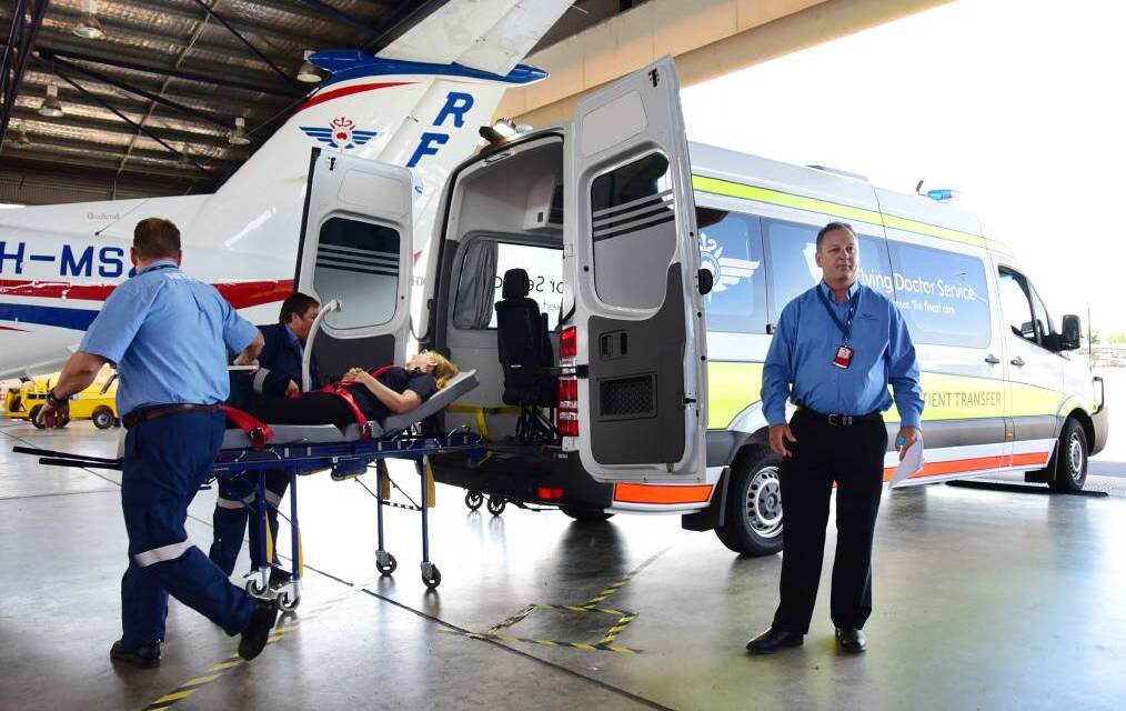 Rural Flying Doctor Service staff at Dubbo demonstrate a patient transfer system at Dubbo airport. Picture by Belinda Soole