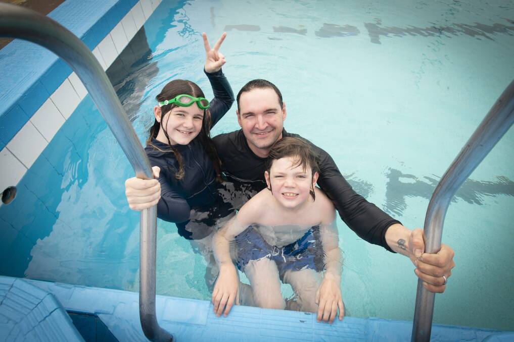 Rose, Blake and Phonix Chapple enjoy a swim at Scully Park pool. Picture by Peter Hardin