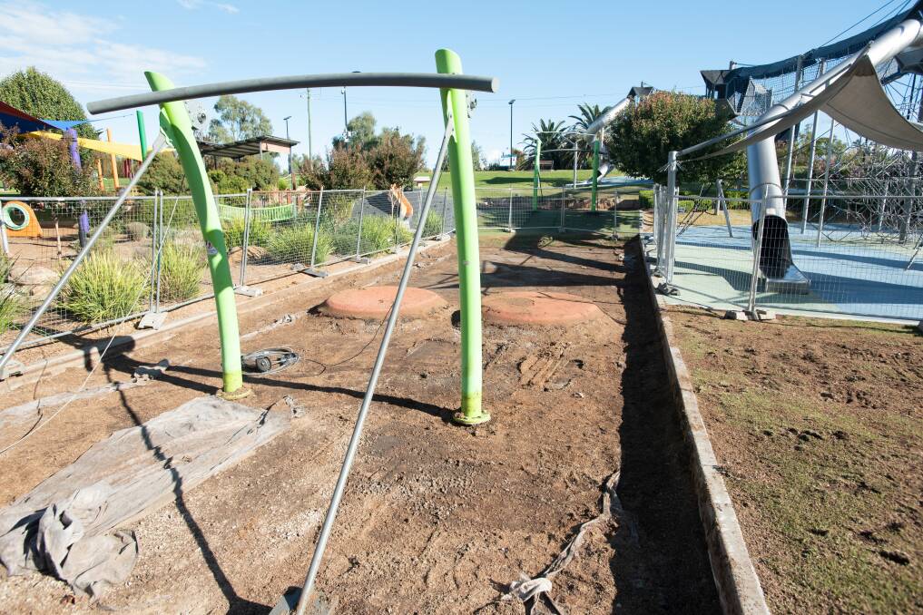 Areas of the Tamworth Regional Playground have been fenced off to replace the bark chips. Picture by Peter Hardin