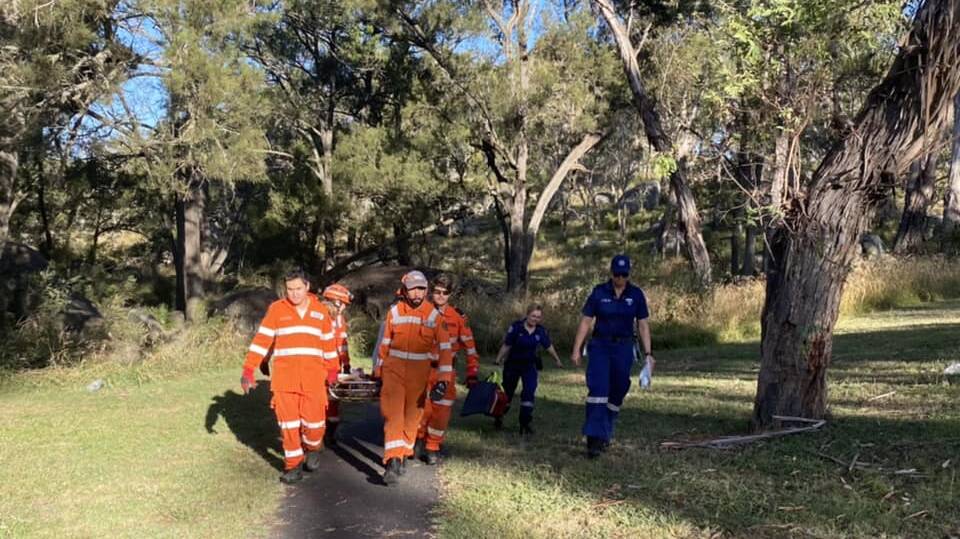 State Emergency Service crews and paramedics worked to free the injured boy on Saturday afternoon. Picture by NSW SES Armidale Unit