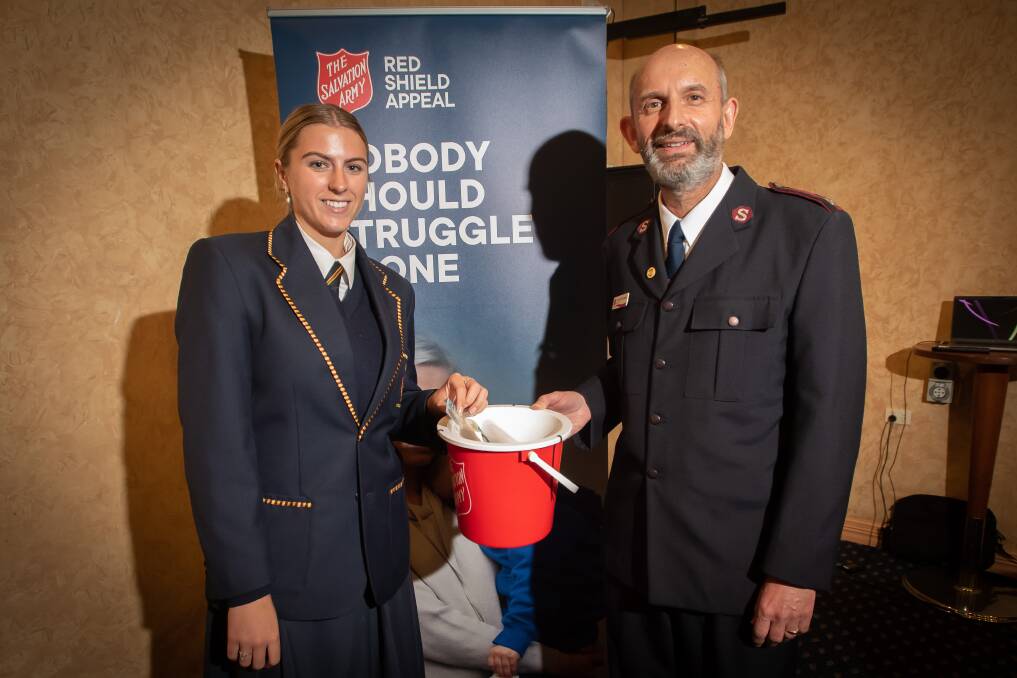 Alyssa Davis and Salvation Army major Tony DeTommaso with a Red Shield Appeal donation box. Picture by Peter Hardin