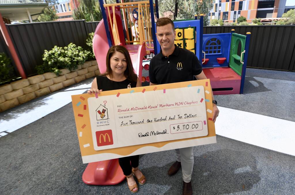 Tamworth Ronald McDonald House manager Rhiannon Curtis accepted a cheque from Maccas licensee Adrian Sippel. Picture by Gareth Gardner