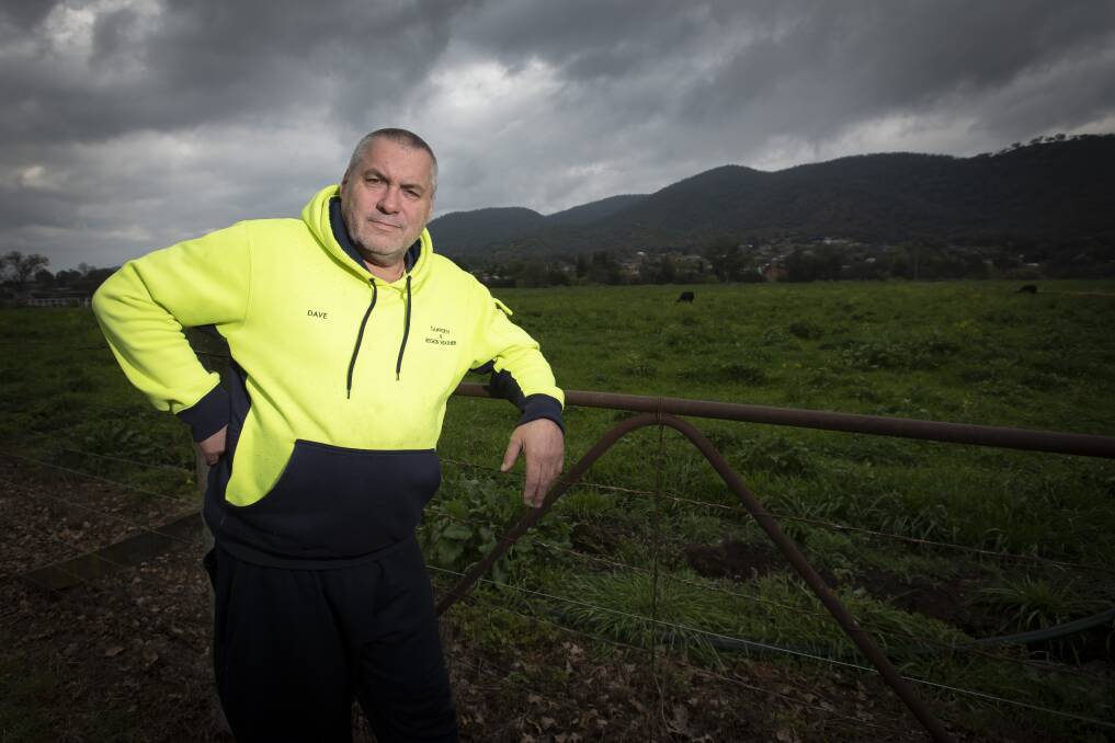 Dave Farrenden stands before heavy clouds passing over Tamworth. Picture by Peter Hardin