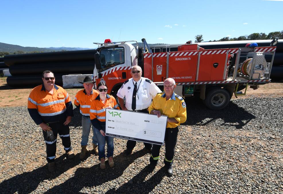 MPC pipeline works Karl Hatfield, Trevor Miles and Tayla Childs with RFS Inspector Stephen Carstons, and Dungowan RFS Captain Jack Hahn to present the fundraising. Picture by Gareth Gardner