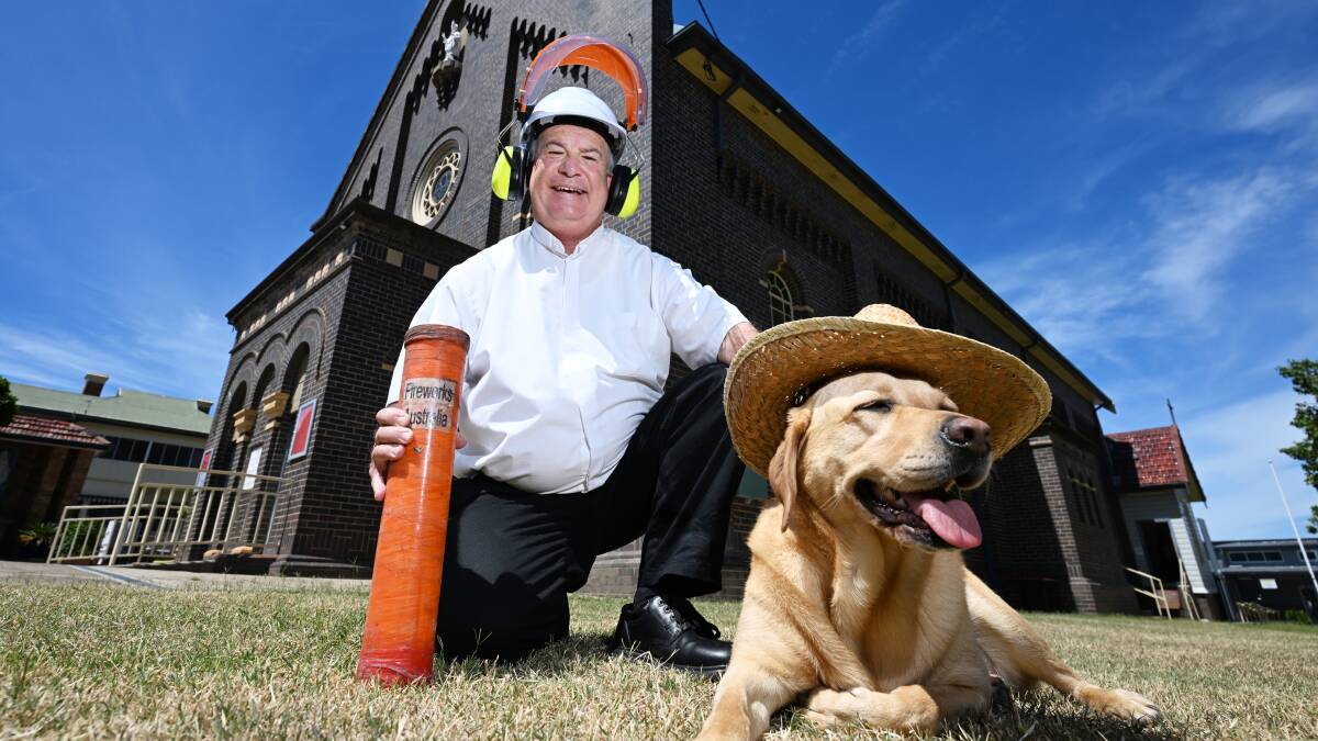 Father Anthony Koppman, left, with his trusty therapy dog Veena, has been planning the Tamworth Country Music Festival's firework display in the months leading up to January 19, 2024. Picture by Gareth Gardner