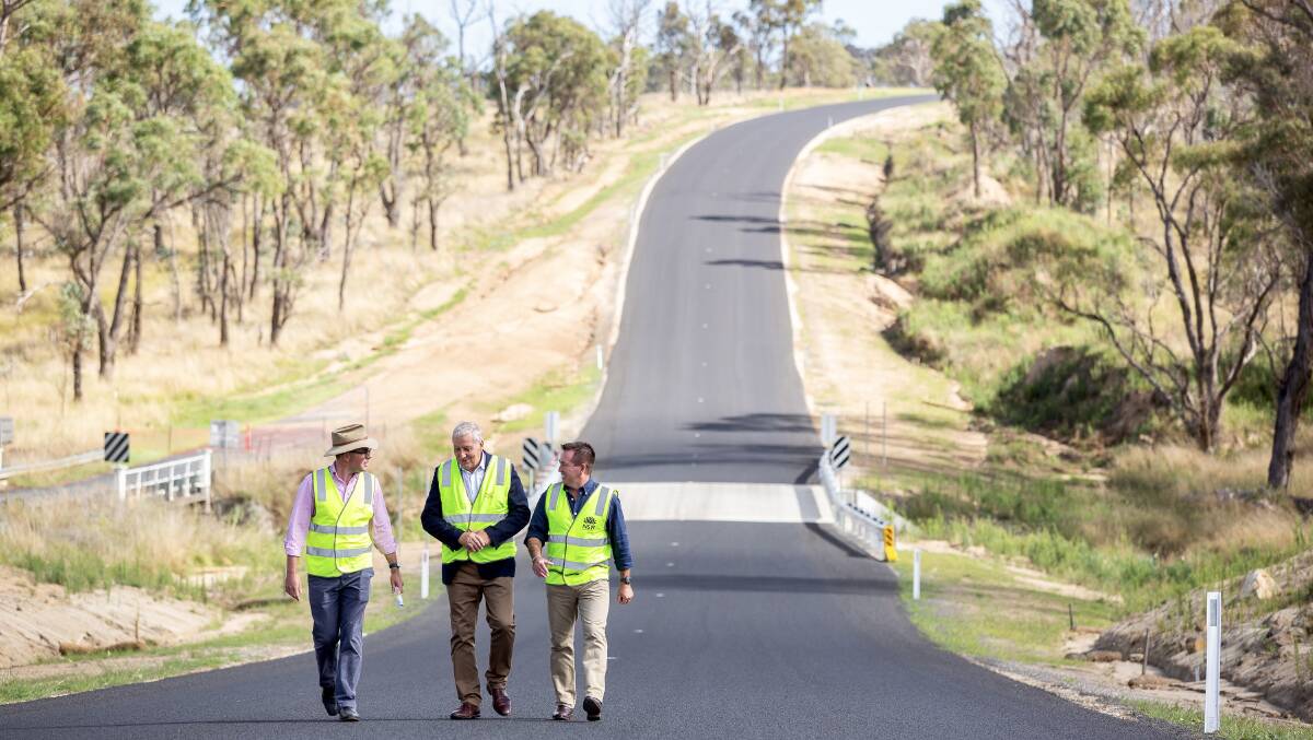 Northern Tablelands MP Adam Marshall, left, Uralla Shire Mayor Robert Bell and NSW deputy premier Paul Tool inspect a stretch of Thunderbolts Way at Tolleys Bridge which was recently aligned with a previous $1 million NSW state government grant. Picture: Simon Scott