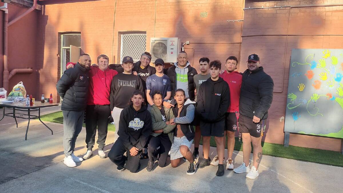 Matty Nean, left, with a group of local students and other Aboriginal Land Council educators outside the PCYC after a workout in Tamworth. Picture supplied.