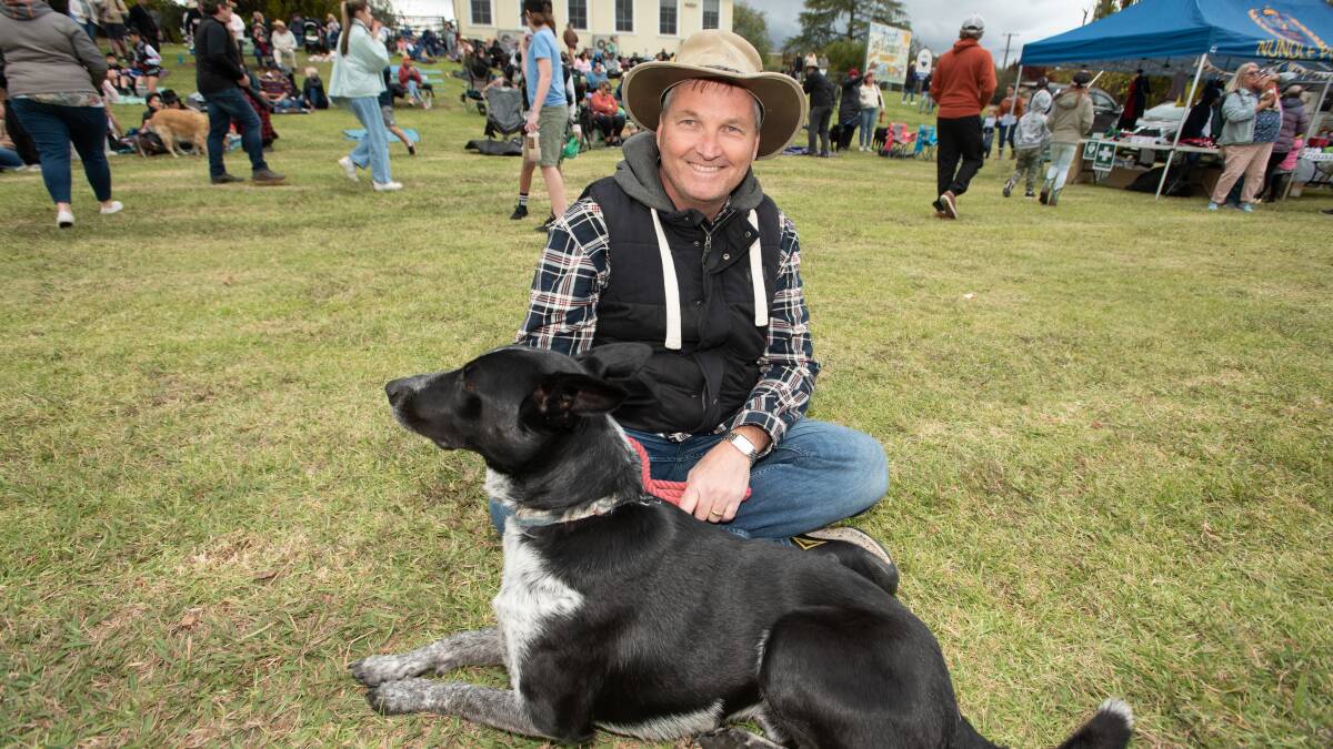 Jeff Neill and his best mate Captain paws for a moment before entering a category to compete for a prize at the Great Nundle Dog Race. Picture by Peter Hardin