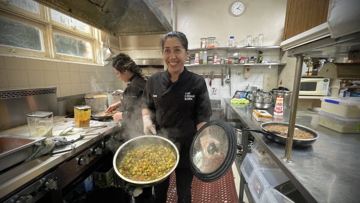 Manal in the Ezidi Place kitchen cooking up a dish of traditional Ezidi food. Picture by Rachel Gray