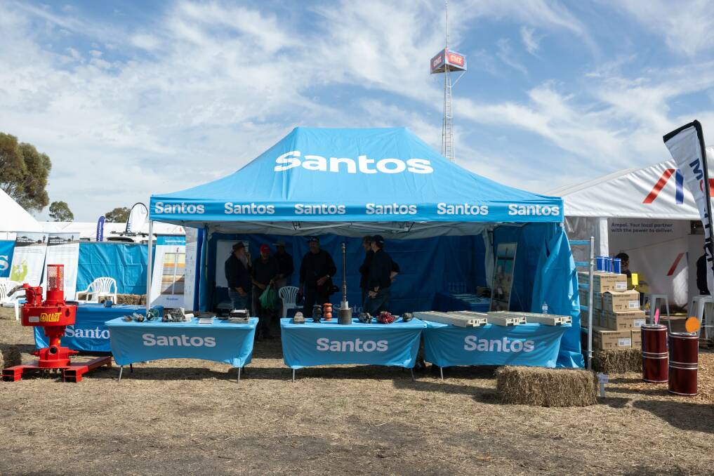 About 200 meters away from where the LPAG is sharing information on coal seam gas extraction's harmful effect on groundwater resources, Santos has a stall dedicated to discussing the economic benefits of its Narrabri gas pipeline. Picture by Peter Hardin