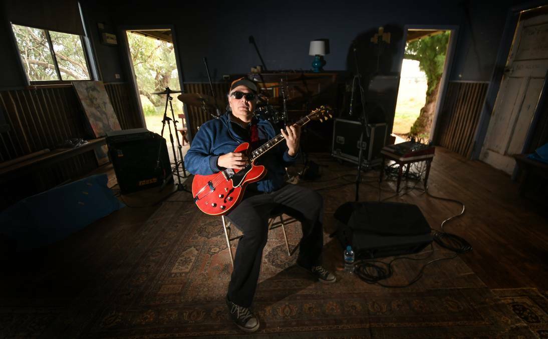 Legendary blues musician Buddy Knox in his "boom boom room" with his signature 1967 Gibson 355, watermelon-red guitar. File picture by Gareth Gardner