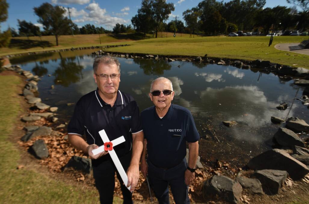 Challenge's Malcolm Turnbull with Tamworth Legacy President Greg Roese at Waler's Pond, the site in which 1000 crosses will be put on display. Picture by Gareth Gardner