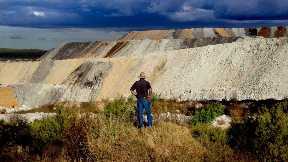 A farmer looks on over the Boggabri coal mine. File picture by Dallas Kilponen