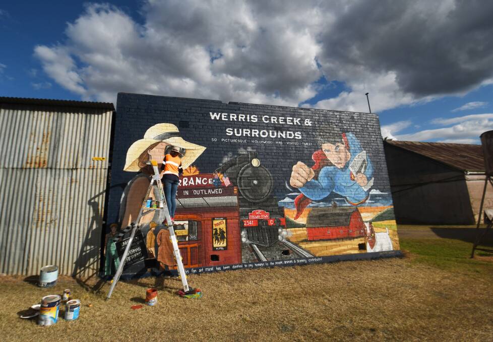 The mural celebrates Werris Creek's involvement in filming the 2006 Superhero movie Superman Returns and Angelina Jolie's 2014 war drama Unbroken. Picture by Gareth Gardner