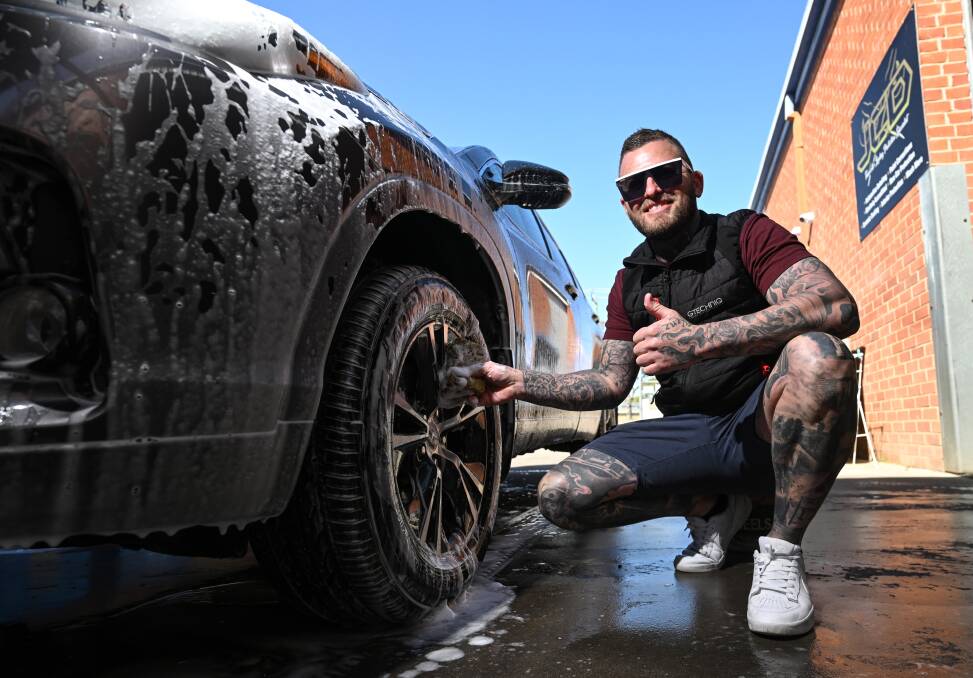 Mr Andrew-Hockley and his team washed more than 30 cars, raising about $2000 for Ronald McDonald House. Picture by Gareth Gardner