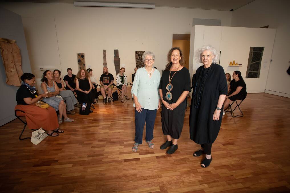 Artist Sybil Orr, Curator Dr Carol McGregor, and artist Liz Williamson in front of textile artists from nearly every state in Australia and every corner of the world. Picture by Peter Hardin