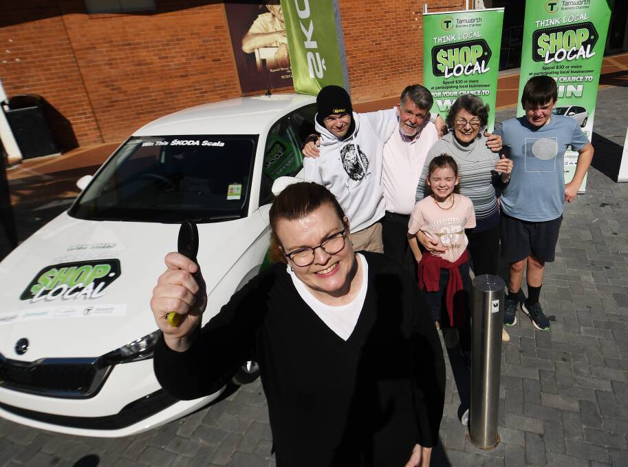 Shop local promotion winner Melinda Bird holds up the key to her newly-won Skoda Scala valued at $33,000. Ms Bird attended the final key draw event with her family on Saturday, May 13, 2023. Picture by Gareth Gardner
