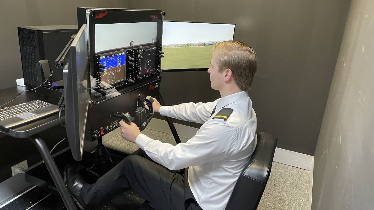 One of the new SFC cohort completes a stationary flight simulation, the school has four different kinds of flight simulations located at the facility. Picture by NDL