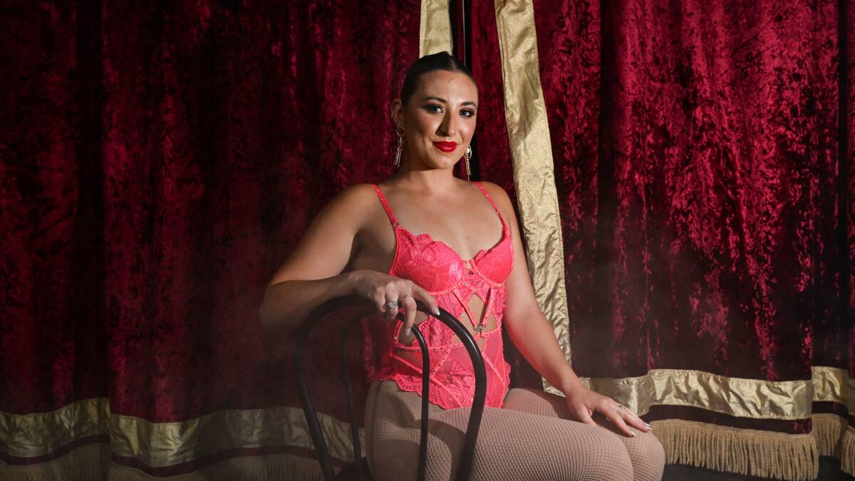 Ms Tinson poses infront of the circus curtain to backstage, where she spends majority of her time prior to a performance. Picture by Gareth Gardner
