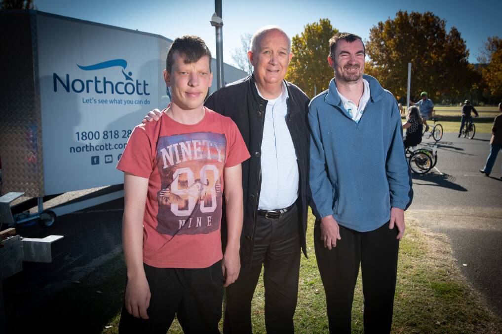 Northcott disability ball organiser, Michael Ticehurst, with two debutantes, Jack Jarman and Ben Fenner. Picture by Peter Hardin