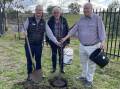 Tamworth Toyota City Principal Dealer Tim Easy, TRC Mayor Russell Webb, and Chairman of Oxley Community Transport Board Ray Tate plant the first tree in the new community garden. Picture by NDL