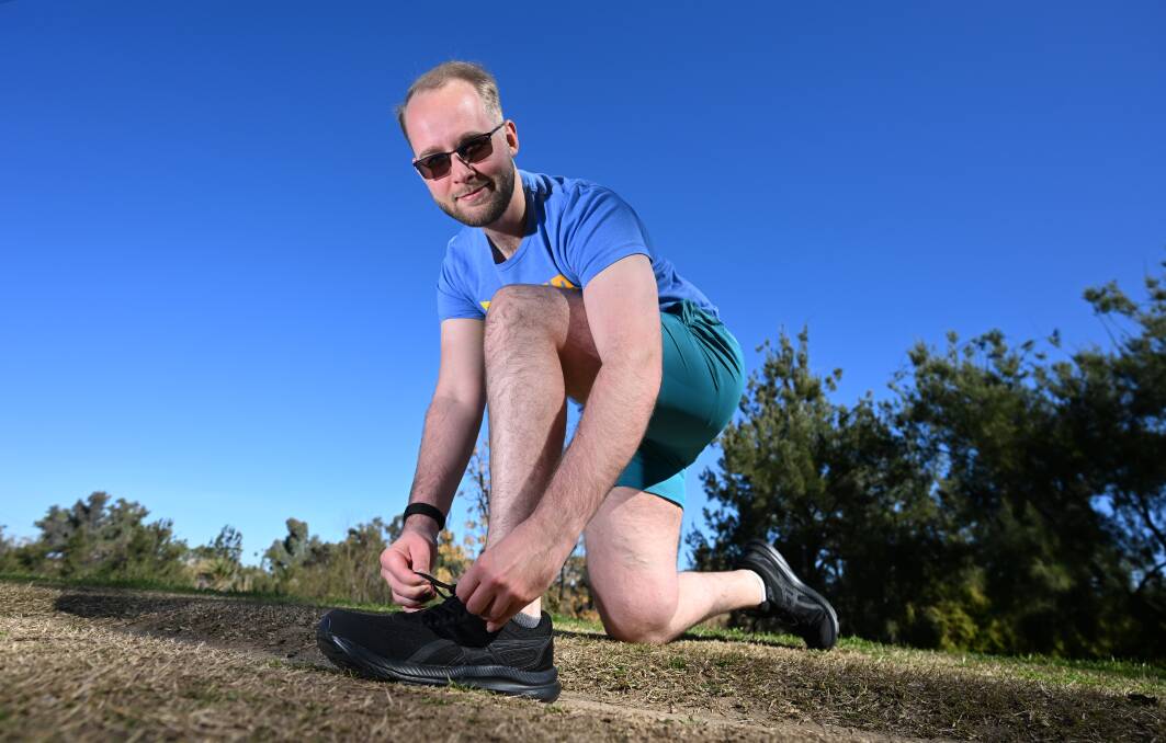 Leader reporter Jonathan "Jono" Hawes is slipping into his favourite pair of runners and shorts to raise $2500 (or more) for Can Assist during August. Picture by Gareth Gardner