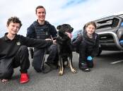 Tamworth High Year 9 students, Ned Harvey and Emily Hiscox with Jeese Swain from the Police Dog Unit, with his canine charge, Bonus. Picture by Gareth Gardner 