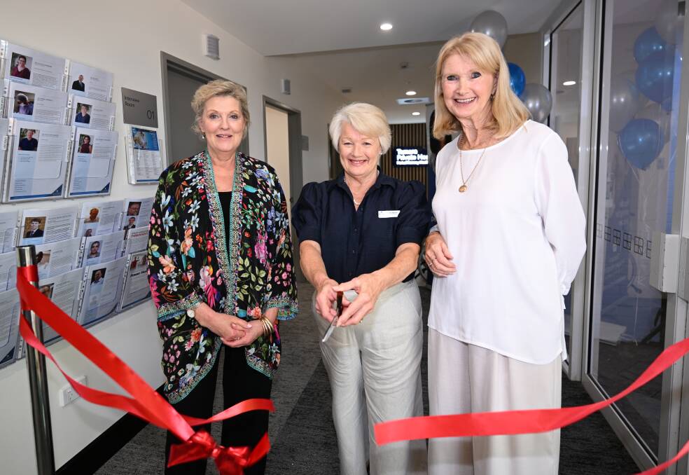 Tamara Private Hospital CEO Debra Maslen (centre) cuts the official ribbon to open the upgraded section of the hospital, flanked by former CEOs, Mary Single (left) and Annette Arthur (right). Picture by Gareth Gardner
