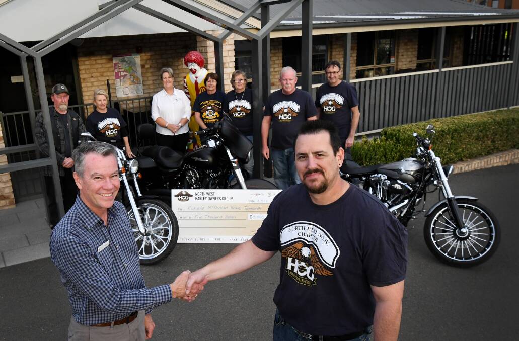 Helping hand: (Front) Ross Bingham (CEO for RMH) and Gavin Westbrook (Assistant Director of the Harley Owners Group).  Photo: Gareth Gardner 040518GGG003