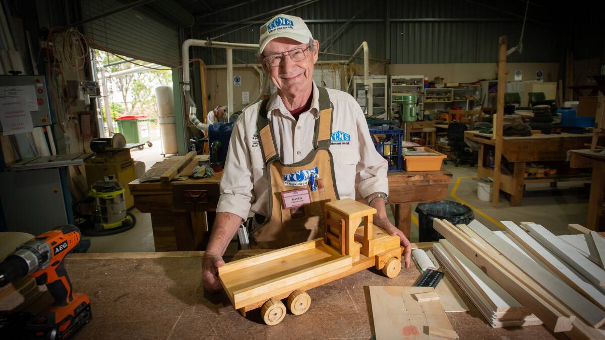 David Greenland with one of the handmade wooden toys that will be on sale at the garage sale on Saturday. Picture by Peter Hardin 