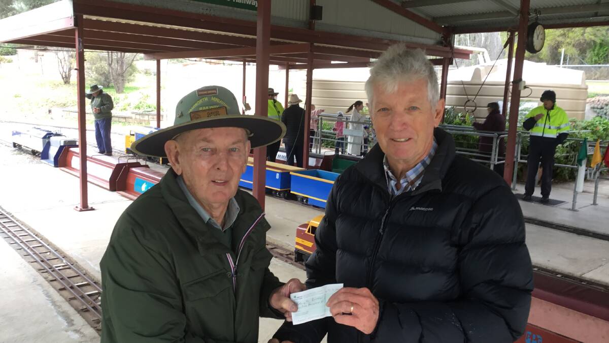 David Scott presents a cheque to Riding for the Disabled (RDA) committee member, Nick McGhie