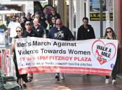 On Friday dozens of people marched in Tamworth to raise awareness of violence against women. Picture by Gareth Gardner.