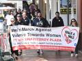 On Friday dozens of people marched in Tamworth to raise awareness of violence against women. Picture by Gareth Gardner.