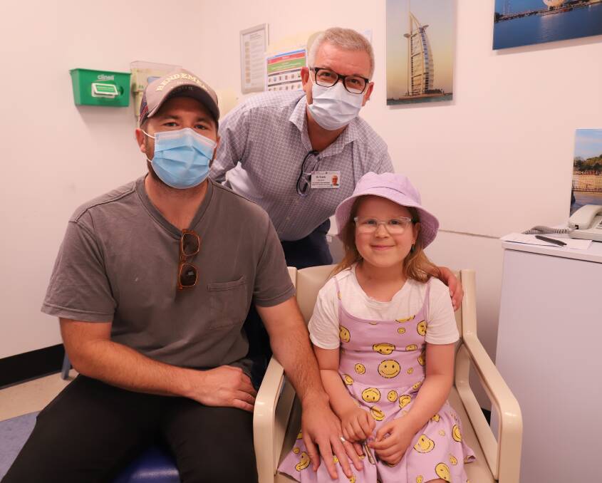 Patient Dottie with her father Dan and oncologist Dr Frank Alvaro. Picture supplied 