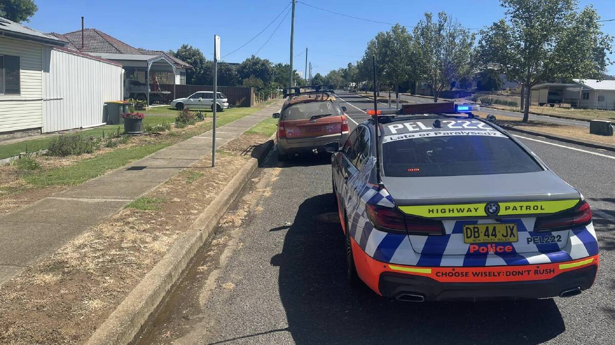 Police stop the car in Barraba on Tuesday. Picture supplied by NSW Police