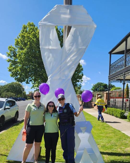 The Tamworth Family Support Service team with local police supporting the Inverell Community Violence Prevention Team White Ribbon march. Picture by TFSS