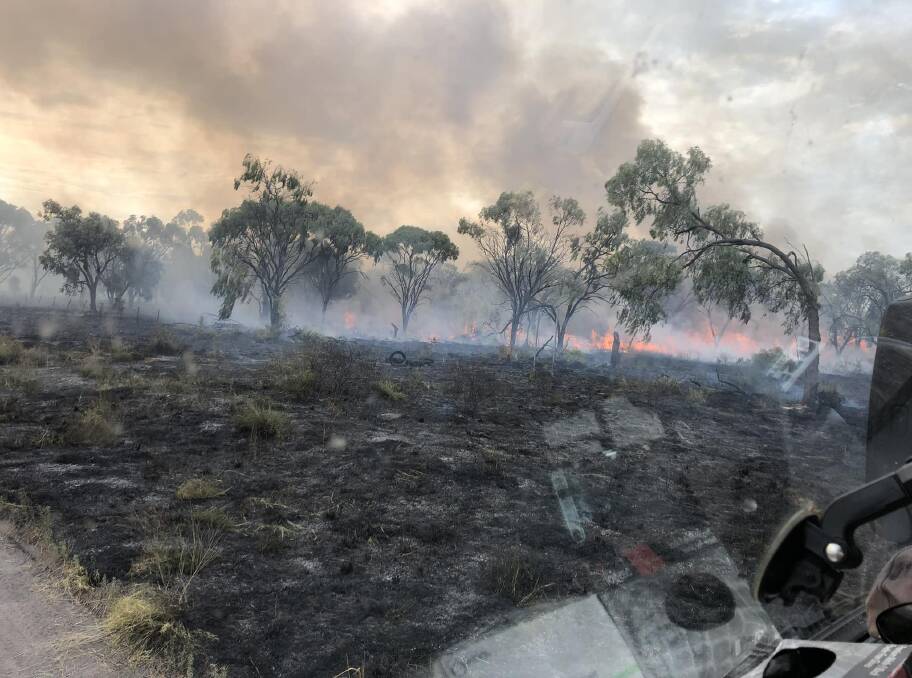 Firefighters douse a suspicious blaze on the outskirts of Moree last week. Picture supplied by Moree RFS