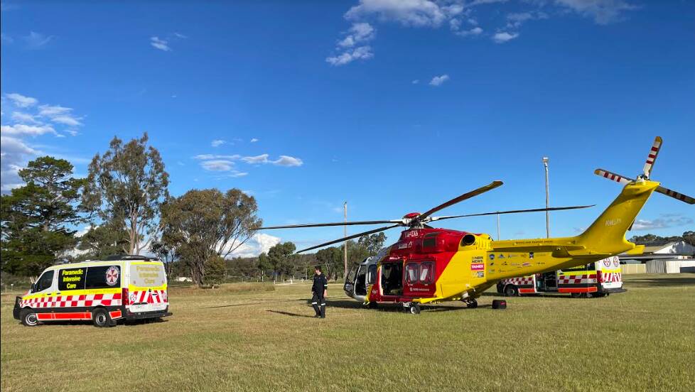 The Westpac Rescue Helicopter with paramedics in Tingha late on Saturday afternoon. Picture supplied by WRHS