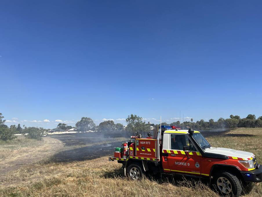 Firefighters douse a blaze on the outskirts of Moree last week. Picture supplied by Moree RFS