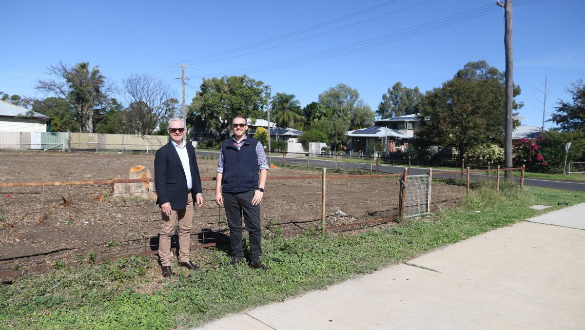 Moree Plains Shire Council Mayor and Council's special projects manager James Maxwell in front of a site just bulldozed. Reduced tip fees are offered as an incentive for landlords to clean up their burnt-out properties.