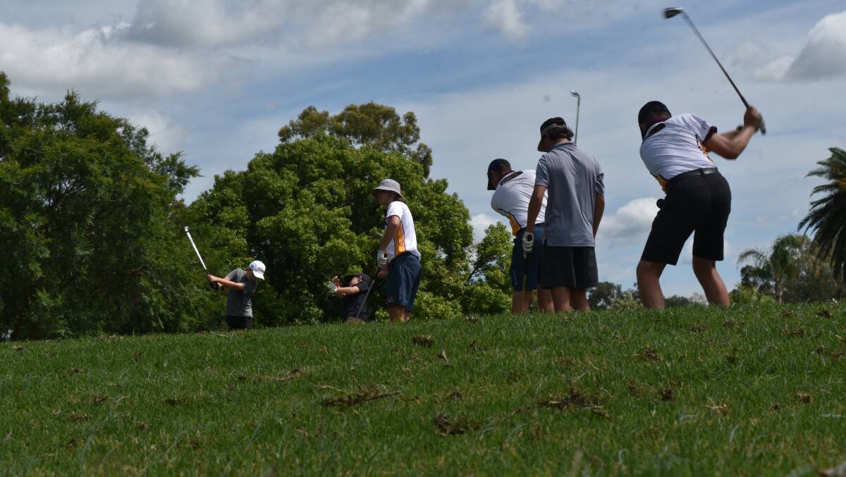 SESSION: NIAS golfers get some irons practice in on the weekend. Photo: Ben Jaffrey