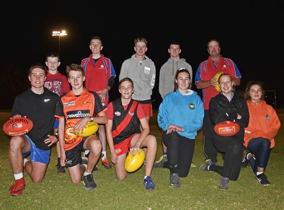 READY TO GO: Tamworth Roosters coach Greg Vallender, back, right, with junior footballers who are taking part in Sunday's gala day.