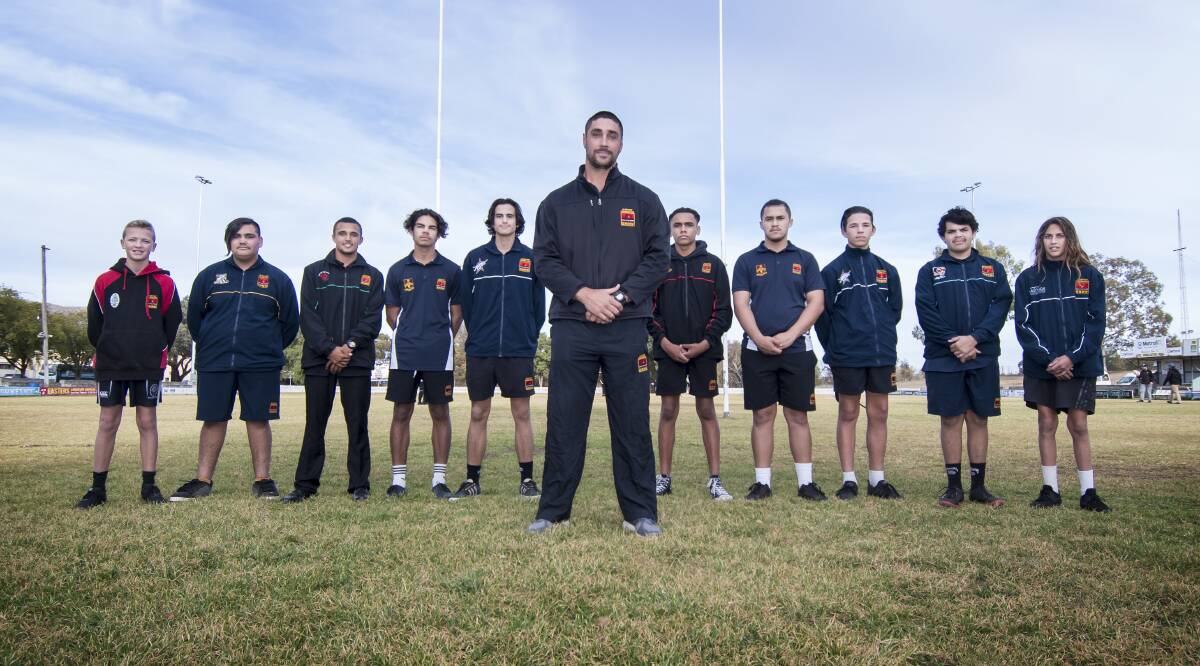 Tom Learoyd-Lahrs with participants of the annual Clontarf Rugby League Carnival in Tamworth. Photo: Peter Hardin
