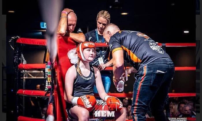 Flemming receives instructions from Scott Chaffey in her last bout. Picture by Iron Monkey Photography