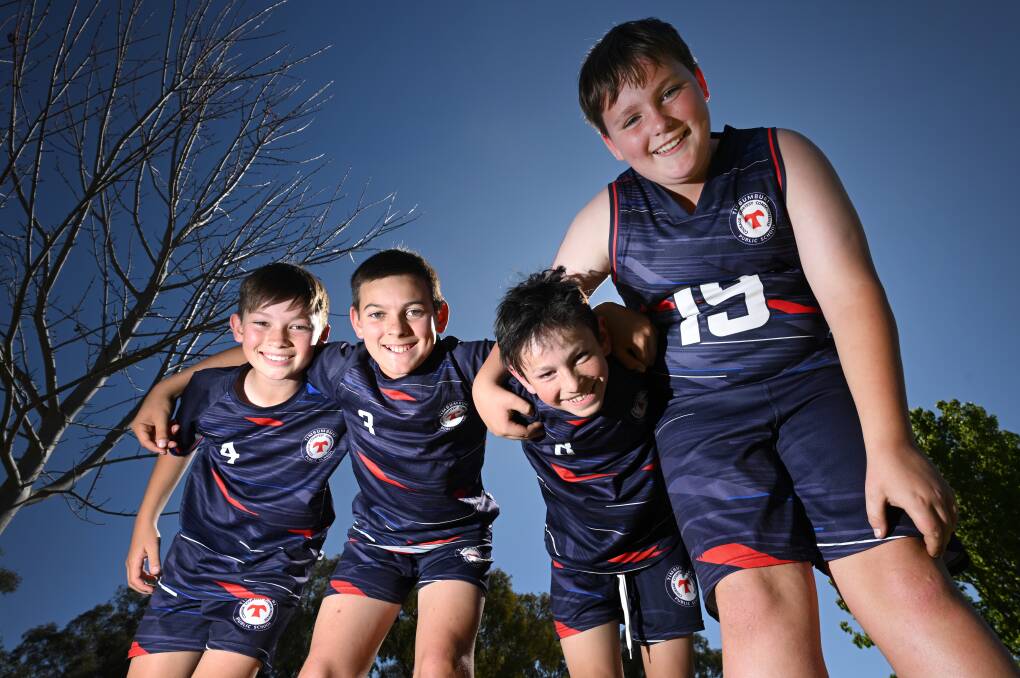 Kody Hollis, left, Levi Morgan, Isaac Ryan and Rylan Byrne are members of Timbumburi Public School's touch football and basketball sides. Picture by Gareth Gardner 