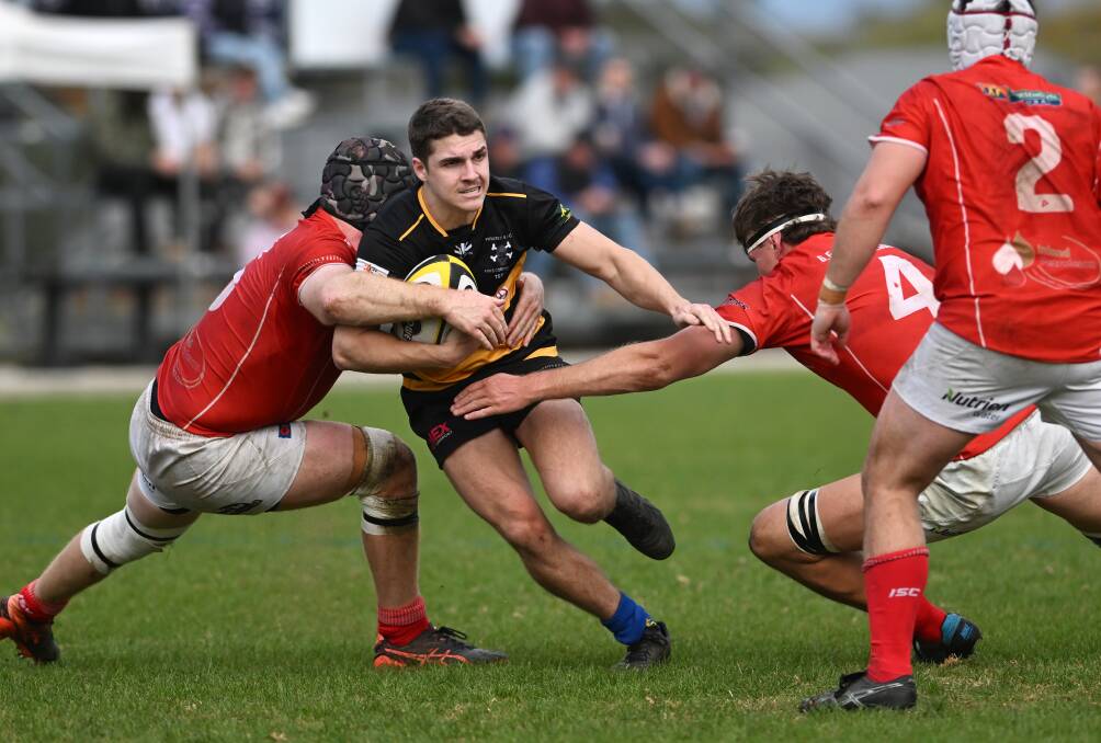 Pirates No. 9 Brad Male is corralled against Gunnedah at Ken Chillingworth Oval. Picture by Gareth Gardner 