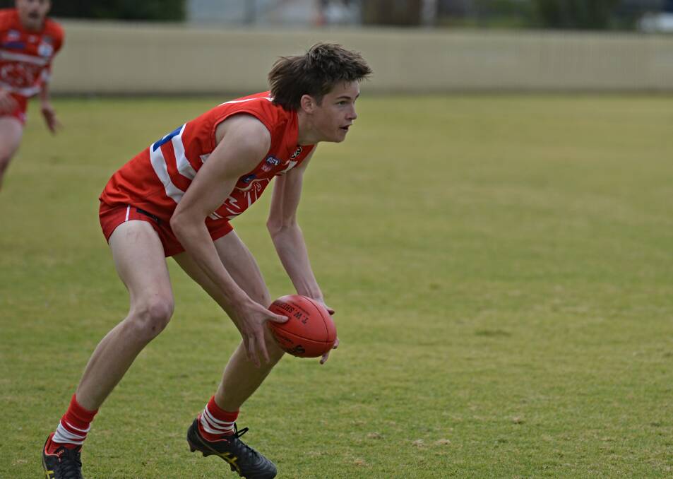 Swans youngster Lachie Ballard evaluates his options in a win over the Nomads at No. 1 Oval on Saturday, July 29