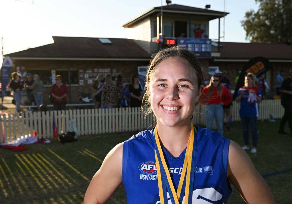 Katrina Rekunow is bathed in late-afternoon light and glory at Wolseley Oval after being named best on ground in the AFL grand final. Picture by Gareth Gardner