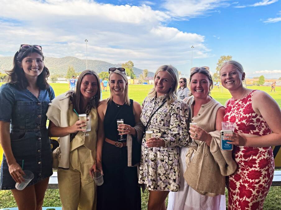 Purtle's partner Edwina Carrigan, third from right, attends Pirates' clash against Scone at Ken Chillingworth Oval on April 13, 2024. 