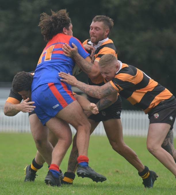 REWIND: Turrell (right) bends the back in a 48-10 defeat of the Knights at Jack Woolaston Oval. 